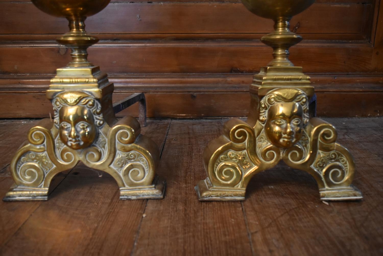 A pair of 19th century brass fire dogs with ball and finials above mask decorated base. H.51 W. - Image 3 of 6