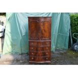 A 20th century Georgian style mahogany tall cabinet.