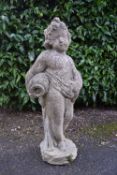 A 20th century reconstituted stone statue of a Classical robed cherub carrying an urn. H.48cm