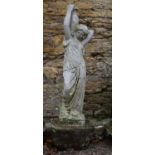 A composite white painted garden statue of a Classical female holding a pot. H.115cm
