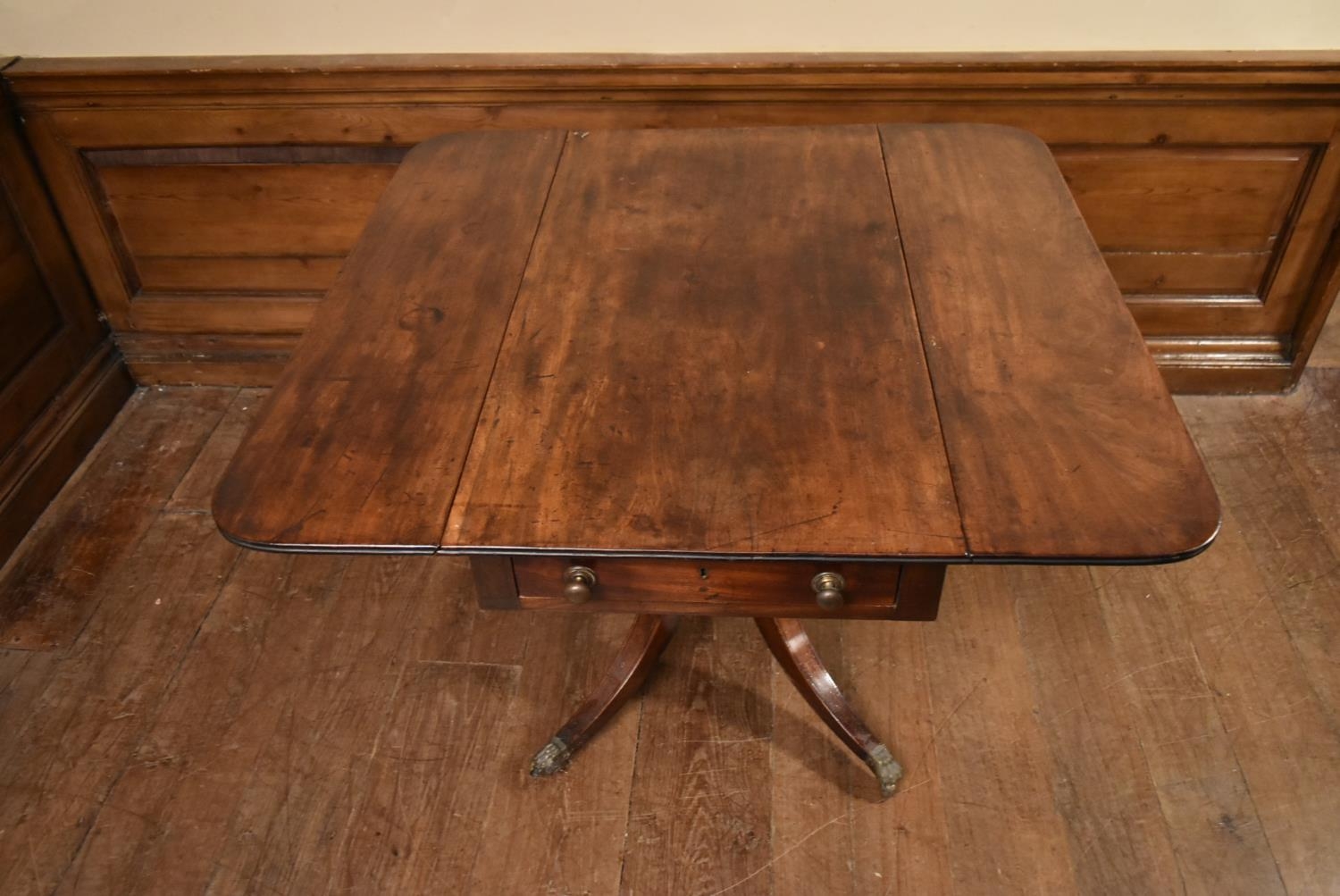 A Regency mahogany drop flap Pembroke table on quadruped swept supports terminating in brass lion' - Image 6 of 6