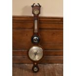 A 19th century mahogany cased mercury wheel barometer with silvered dial and satinwood inlay. H.98