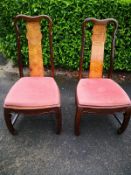 A pair of Chinese carved hardwood dining chairs. H.105 W.52 D.47cm