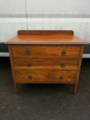 A mid century light oak chest of drawers on block supports. H.85 W.92 D.46cm