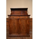 A Regency flame mahogany chiffonier with raised superstructure above frieze drawer and panel doors
