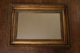A 19th century carved gilt framed mirror with laurel motif and beading. H.57 W.77cm