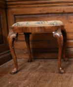 An early 20th century early Georgian style walnut stool with drop in tapestry seat. H.48cm