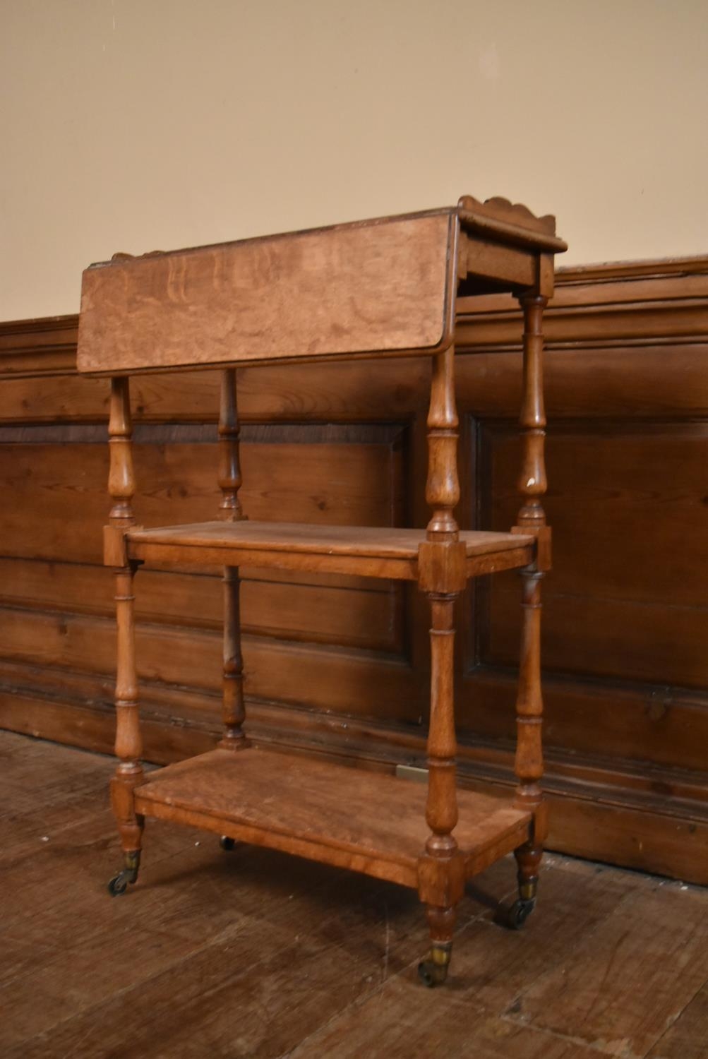 A late 19th century oak drop flap three tier buffet whatnot on turned supports terminating in - Image 3 of 10