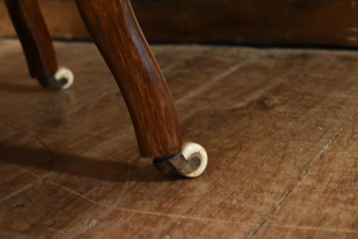 A Victorian tub shaped nursing chair in buttoned upholstery on turned tapering supports resting on - Image 4 of 5