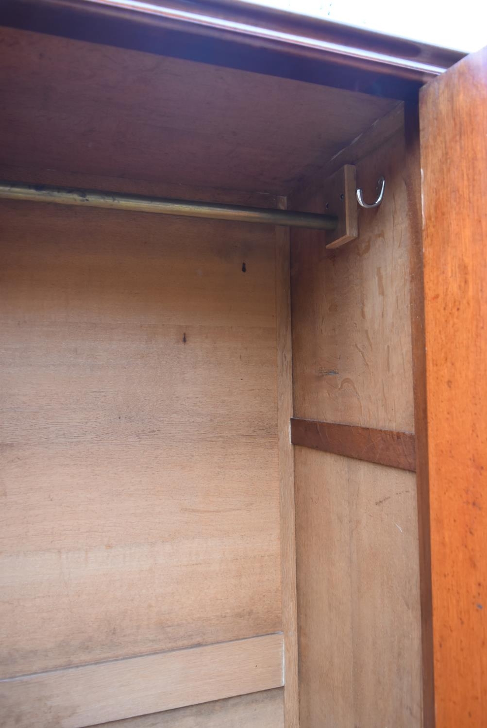 A 19th century flame mahogany two section wardrobe with panel doors enclosing full height hanging - Image 6 of 9