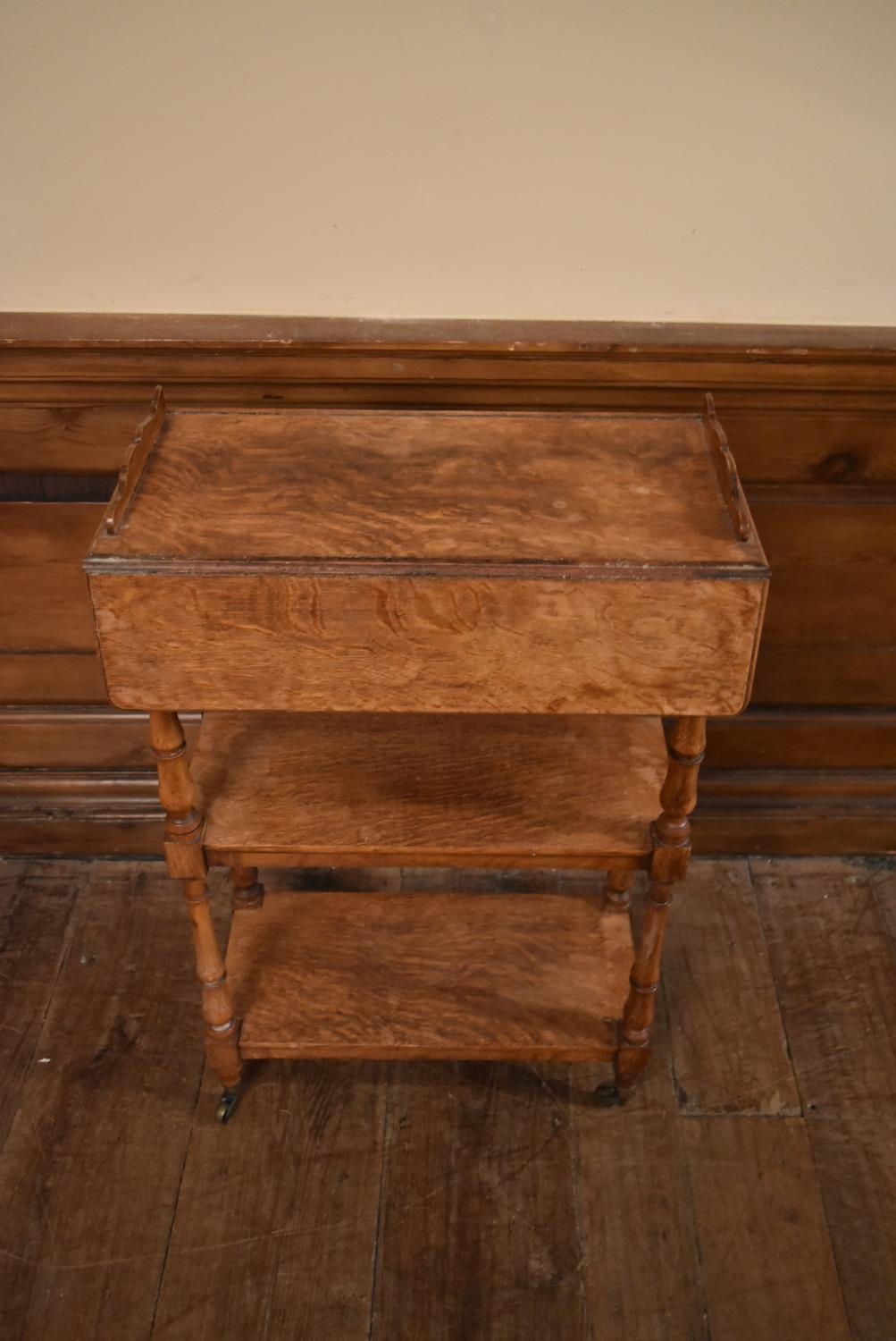 A late 19th century oak drop flap three tier buffet whatnot on turned supports terminating in - Image 2 of 10