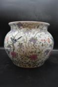 A Chinese porcelain aquarium bowl with hand painted foliate detail and marked to the base. H.31