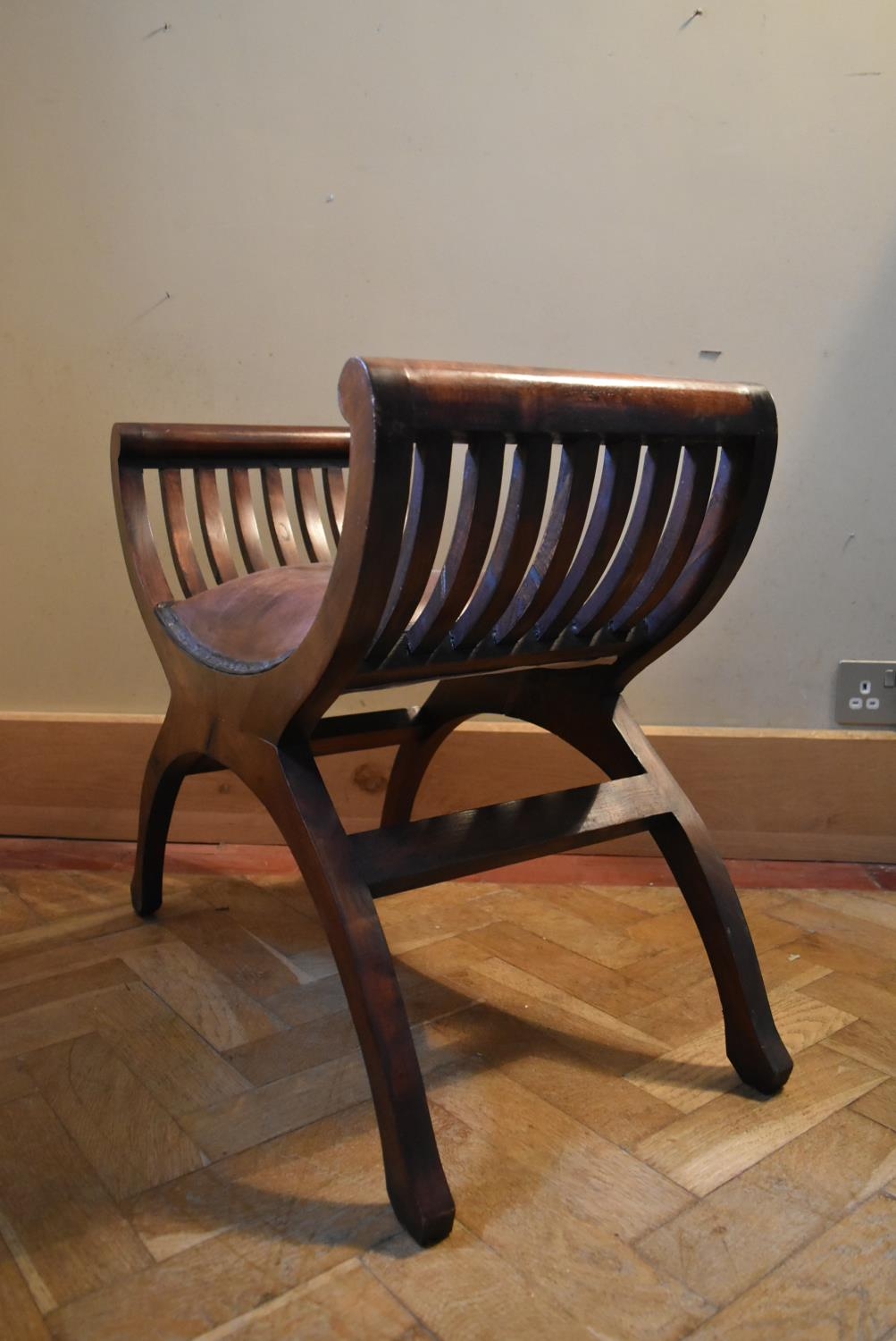 A mahogany X frame stool in leather upholstery. H.58 W.64 D.36cm - Image 4 of 5