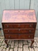 A 20th century mahogany bureau