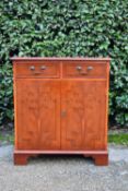 A Georgian style yew wood side cabinet. H.81 W.72 D.40cm