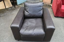 A contemporary black leather armchair