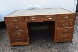 A mid century oak pedestal desk. (veneer missing as photographed)