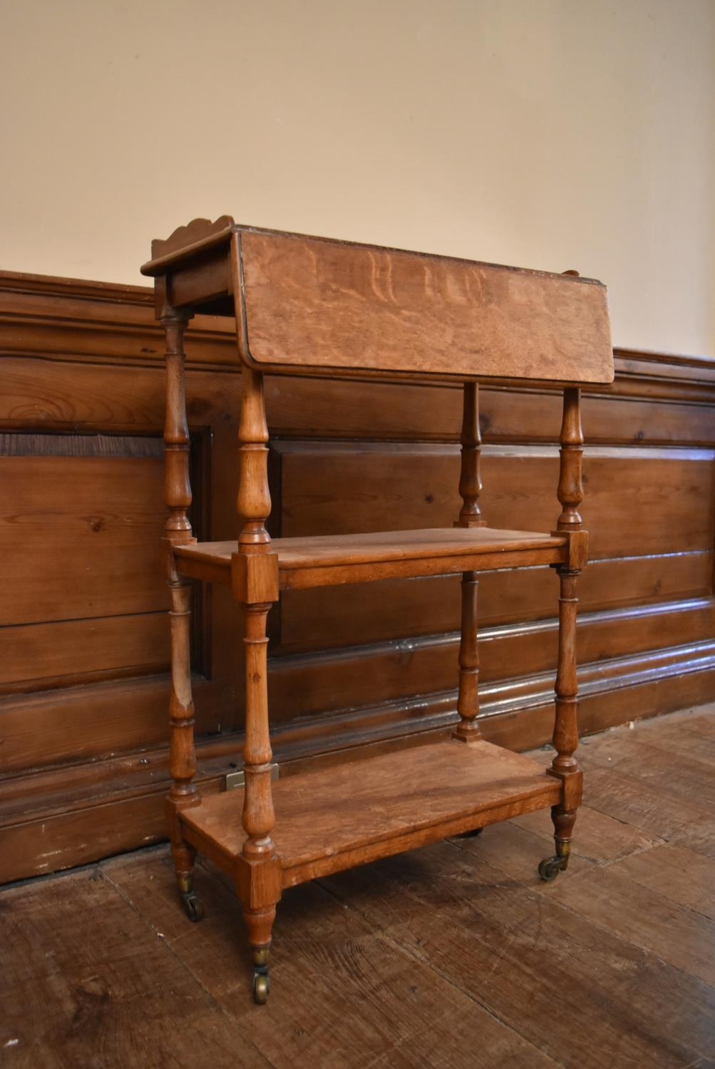 A late 19th century oak drop flap three tier buffet whatnot on turned supports terminating in - Image 4 of 10