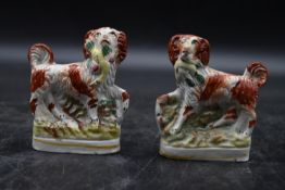A pair of 19th century flatback Staffordshire pottery tan and white spaniels. H.12 W.9cm (2)