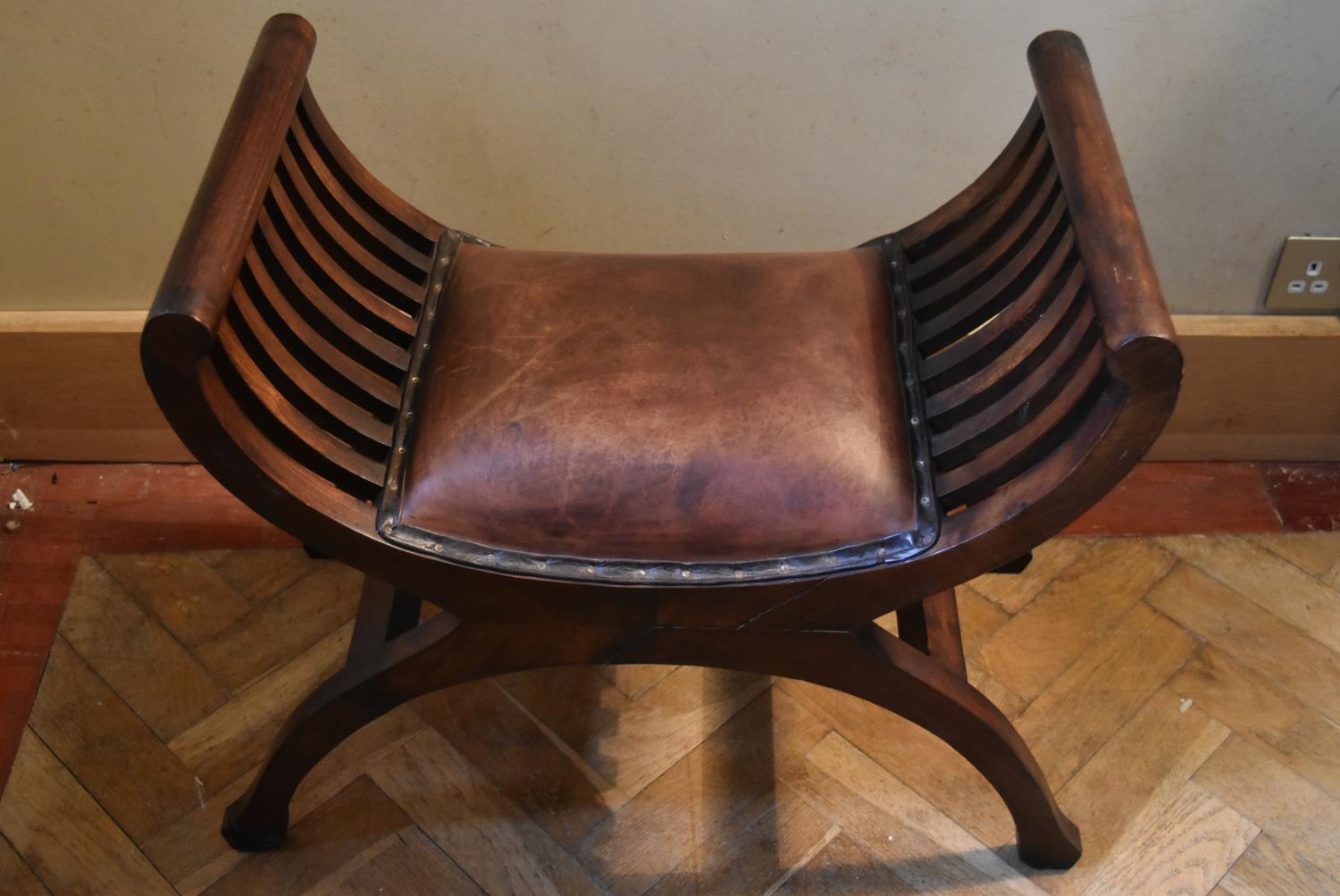 A mahogany X frame stool in leather upholstery. H.58 W.64 D.36cm - Image 3 of 5