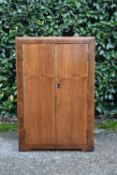 An Art Deco figured walnut and crossbanded record cabinet. H.78 W.51 D.38cm