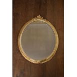 A 19th century gilt framed wall mirror with floral gesso decoration. H.74 W.61cm
