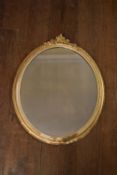 A 19th century gilt framed wall mirror with floral gesso decoration. H.74 W.61cm
