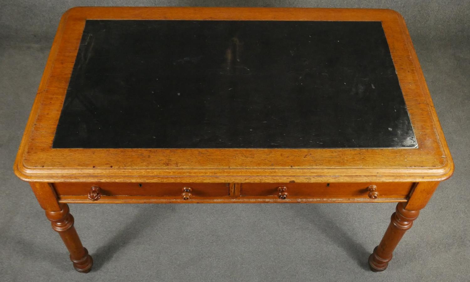 A 19th century mahogany writing table with two frieze drawers raised on turned tapering supports. - Image 4 of 5