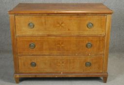 A 19th century Continental walnut three drawer commode with starburst inlay on squat tapering square