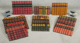 A collection of fifteen panels of faux book spines to include various sets and classic editions