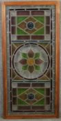 A C.1900 stained and leaded glass panel in mahogany frame. H.107 W.51cm