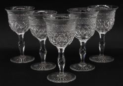 Five hand cut lead crystal sherry glasses. With crosshatched design, star cut bases and flared rims.