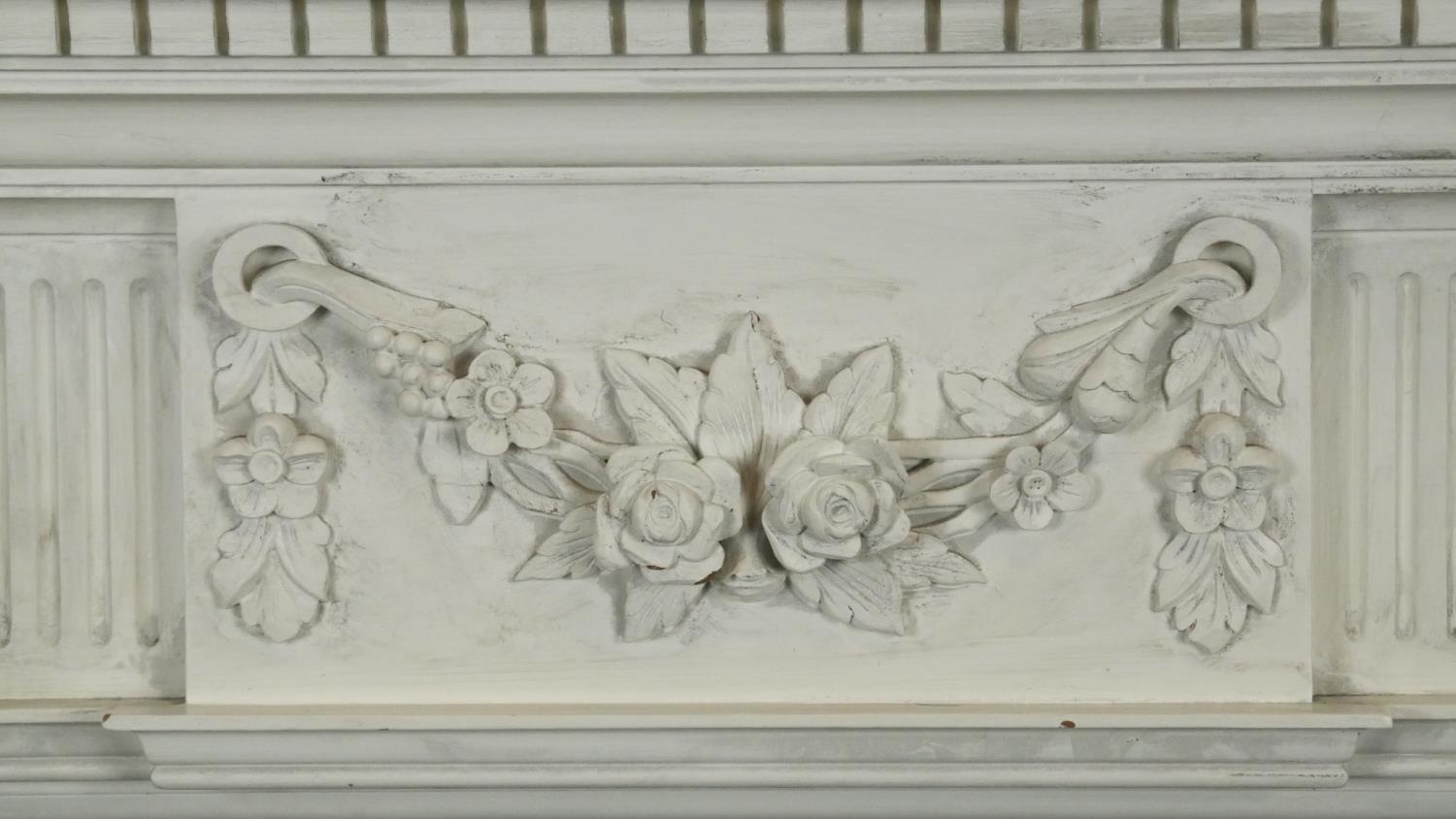 A carved and painted Adam style fire surround with floral swag decoration to the frieze. H.120 W. - Image 2 of 5