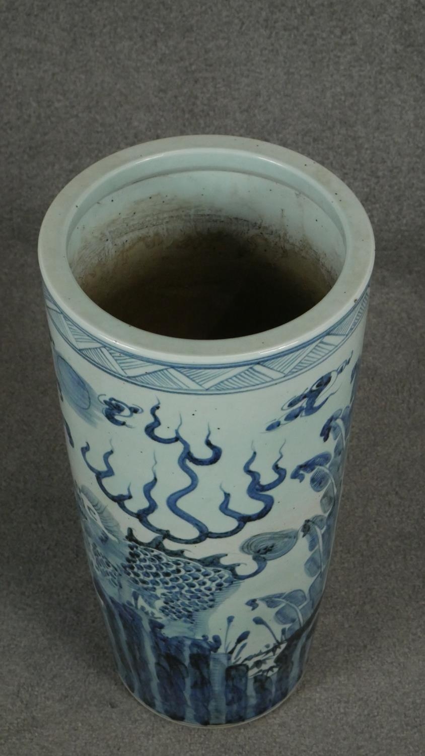 A 20th century Chinese blue and white hand painted umbrella stand decorated with animals and - Image 3 of 8