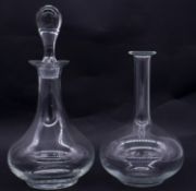 Two glass decanters one by Villeroy & Bosch. (One missing stopper) H.34cm