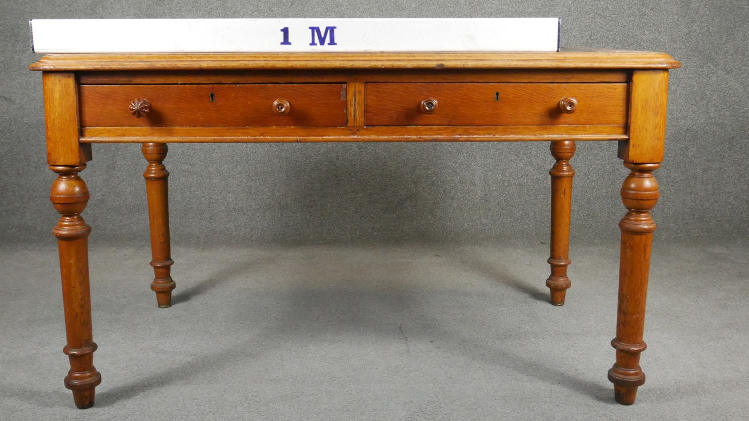 A 19th century mahogany writing table with two frieze drawers raised on turned tapering supports. - Image 5 of 5