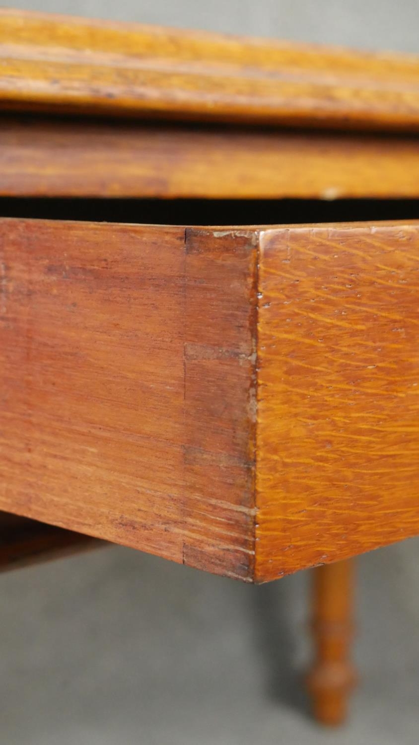 A 19th century mahogany writing table with two frieze drawers raised on turned tapering supports. - Image 3 of 5