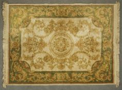 An Aubusson style rug with all over floral decoration. L.167 W.122cm