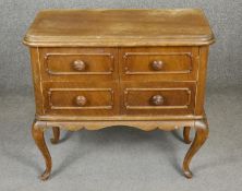 A French Provincial style walnut chest on cabriole suppports. H.60 W.65 D.32cm