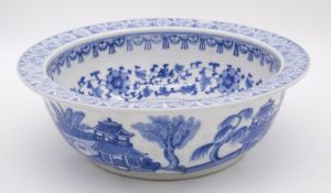 A blue and white Chinese porcelain glazed bowl with stylised floral and foliate design. D.34cm