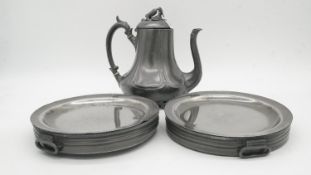 A 19th century pewter Shaw & Fisher gourd teapot with two pewter twin handled warming dishes by