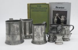 A collection of 19th century pewter and two books on the history of pewter. The measures are a