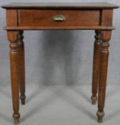 A C.1900 stained pine side table on turned tapering supports. H.95 W.83 D.49cm