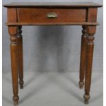A C.1900 stained pine side table on turned tapering supports. H.95 W.83 D.49cm
