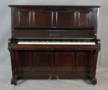 A Boyd of London mahogany cased upright piano with maker's mark to the iron frame. H.131.5 W.148 D.