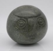 An abstract carved stone head. Signed to the base. H.13cm