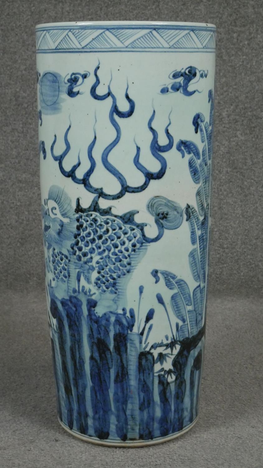 A 20th century Chinese blue and white hand painted umbrella stand decorated with animals and - Image 2 of 8