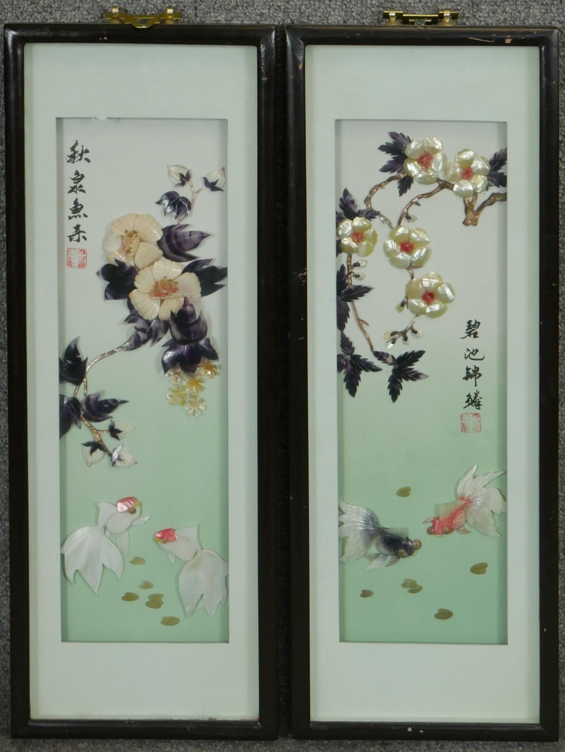 Two framed and glazed Oriental relief works made from different types of sea shells, with