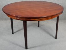 A vintage Dyrland Lotus 'flip flap' table with pull out folding arc extensions. H.72 D.128 D.180cm