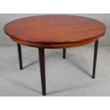 A vintage Dyrland Lotus 'flip flap' table with pull out folding arc extensions. H.72 D.128 D.180cm